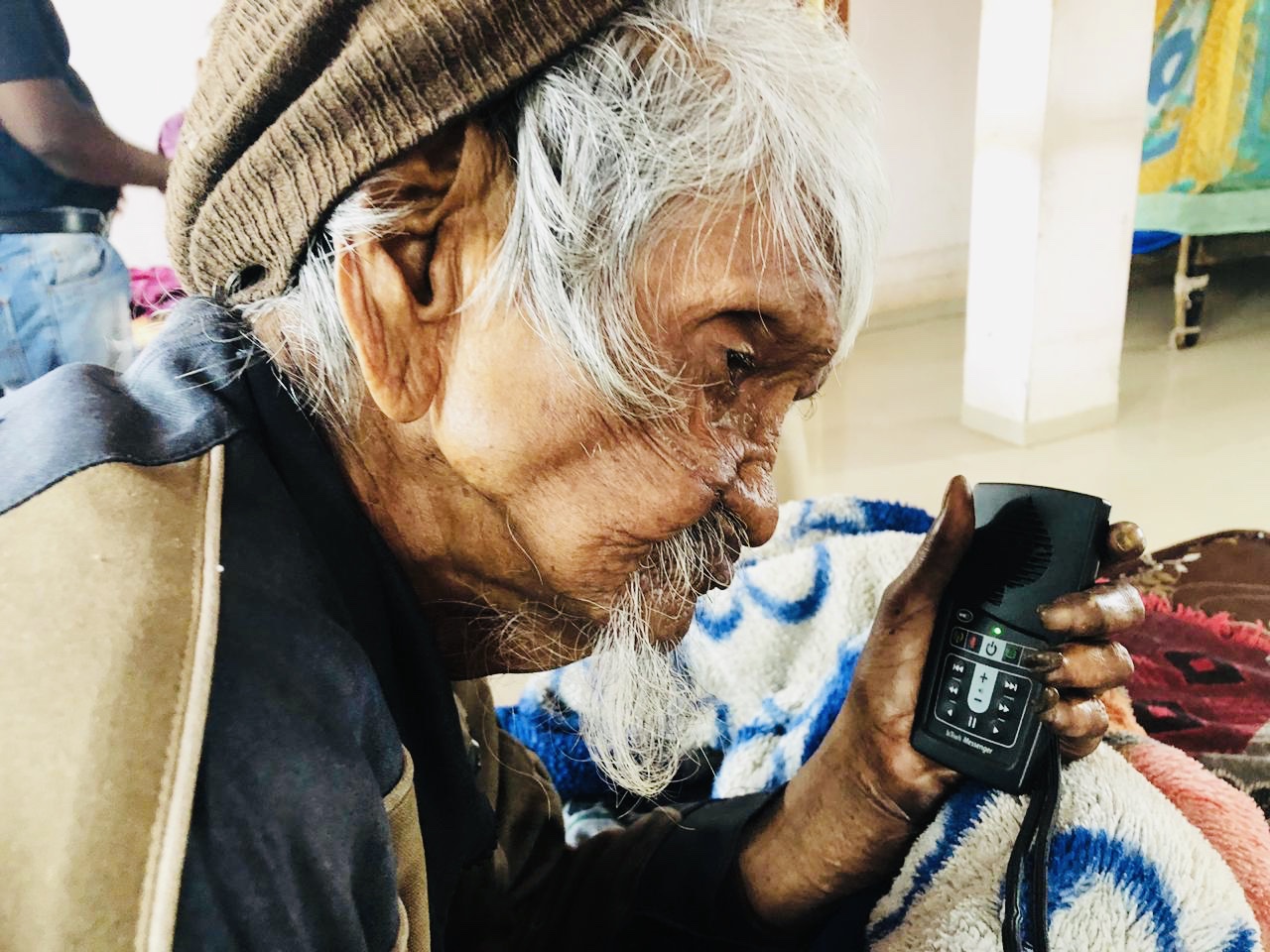 Indian Elder Listening to MegaVoice Audio Bible