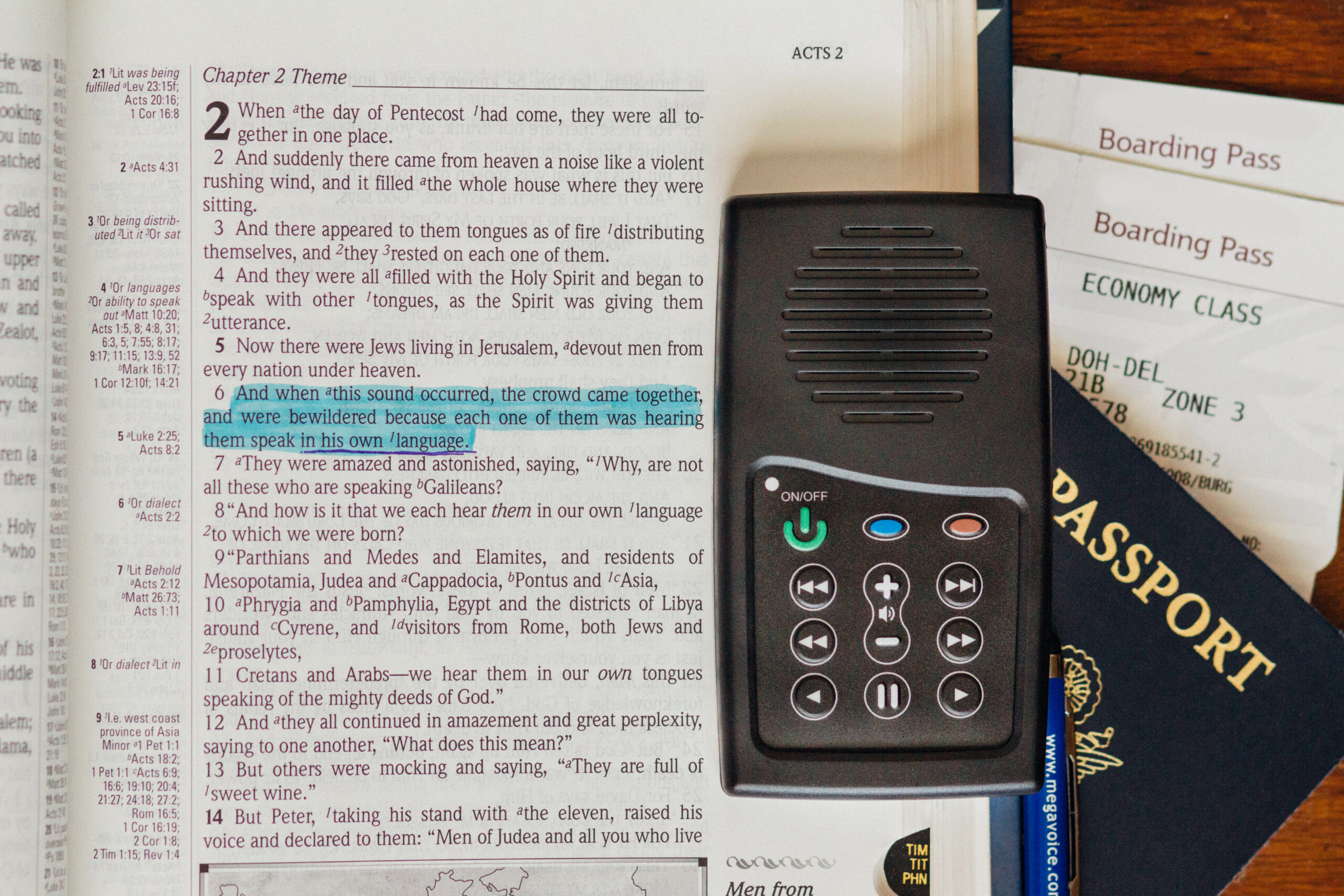 MegaVoice audio Bible and print Bible open to the verse, "And when this sound occurred, the crowd came together, and were bewildered because each one of them was hearing them speak in his own language."