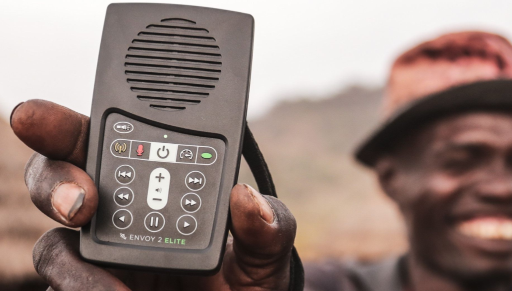 Smiling Man Holds MegaVoice Audio Bible